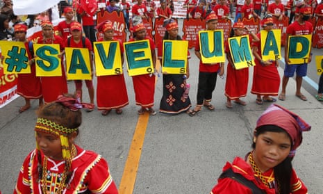 The Philippines’ indigenous Lumad people carry the message ‘Save Lumad schools’ during a march in Manila.