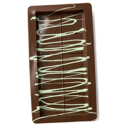 tin drizzled with green choc