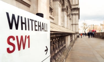 A close-up of a street sign for Whitehall in central London