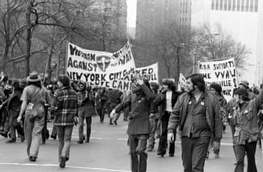 People hold anti-Vietnam war banners