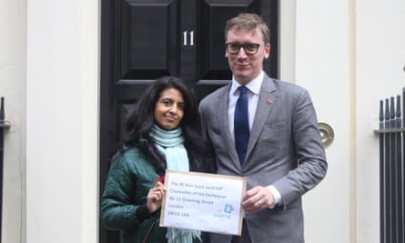 Konnie Huq and Steven Lotinga of the Publishers Association with a letter signed by 90 MPs at Downing Street on Thursday 31 October
