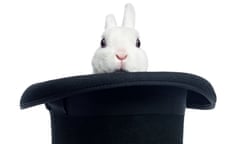 The head of a white rabbit sticking out of a top hat