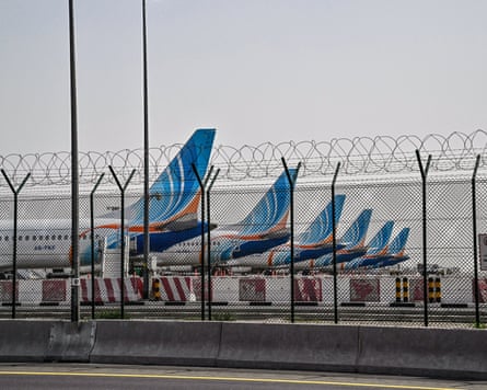 FlyDubai planes are parked on the tarmac at Dubai international airport
