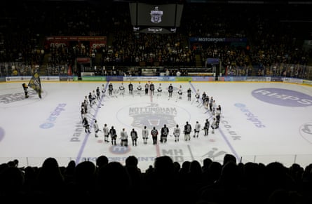The players form a circle in memory of Adam Johnson