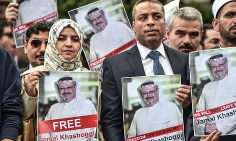 Protestors hold pictures of missing journalist Jamal Khashoggi during a demonstration in front of the Saudi Arabian consulate in Istanbul