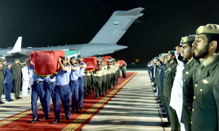 Emirati soldiers carry coffins of UAE soldiers killed in the deadly missile attack.