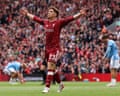 Víctor Muñoz raises his arms in delight after scoring a goal for Liverpool