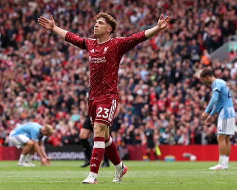 Víctor Muñoz raises his arms in delight after scoring a goal for Liverpool