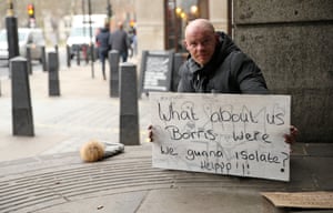 A homeless man asks for help at the start of the pandemic in March.