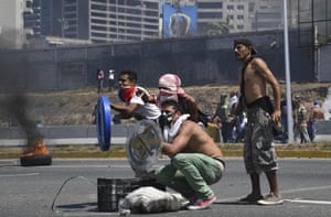 Protesters clash with soldiers loyal to Maduro
