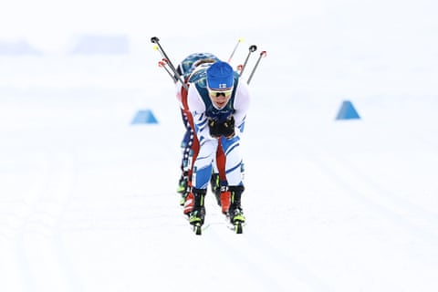 Finland's Lauri Vuorinen (front) and felllow athletes compete during the men's cross country 50km mass start final.