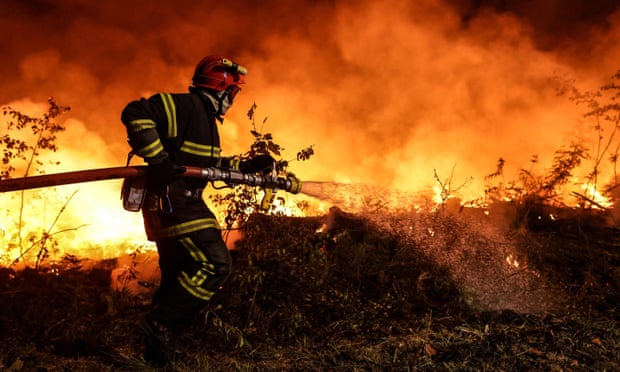 Photo of fireman fighting a wildfire