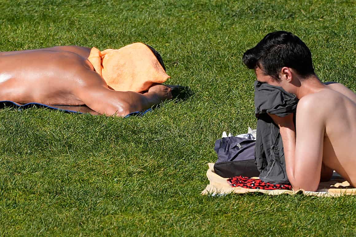 People sunbathe at Dolores Park in San Francisco, Tuesday.