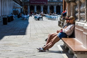 People relax in St. Marks’s Square