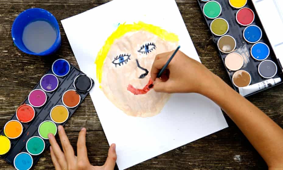 A child painting a smiling face
