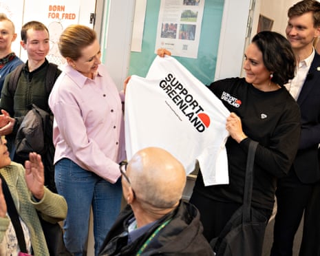 Denmark's Social Democrats' leader Mette Frederiksen receives a shirt with the message "Support Greenland" from Julie Rademacher at a meeting with Greenlanders on election day, in Aalborg, Denmark in March this year.