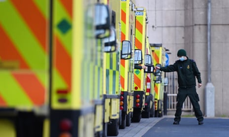 An ambulance worker stands outside the Royal London Hospital in London in January. 