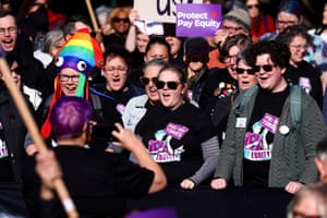 Protesters wear protect pay equity t-shirts