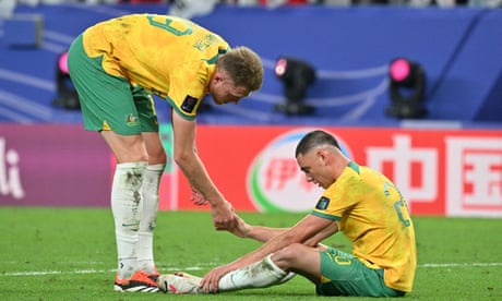 FBL-ASIA-2023-MATCH46-AUS-KOR<br>Australia's defender #19 Harry Souttar consoles Australia's defender #20 Lewis Miller after their defeat in the Qatar 2023 AFC Asian Cup quarter-final football match between Australia and South Korea at Al-Janoub Stadium in al-Wakrah, south of Doha, on February 2, 2024. (Photo by HECTOR RETAMAL / AFP) (Photo by HECTOR RETAMAL/AFP via Getty Images)