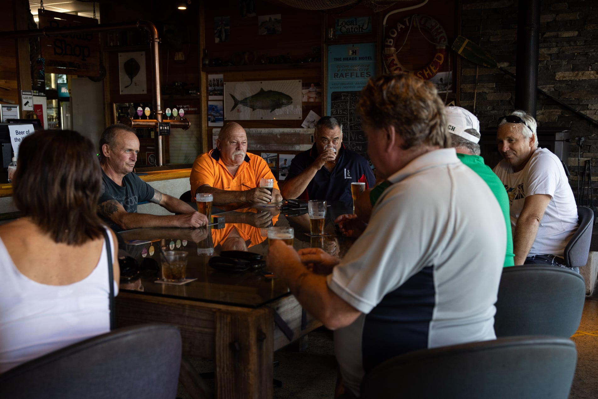 Locals (quiet Australians) sit around the Table Of Knowledge at the Shoalhaven Heads Hotel in Shoalhaven Heads.