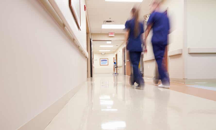 Nurses in a hospital corridor.