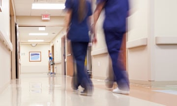 A hospital corridor with medical staff