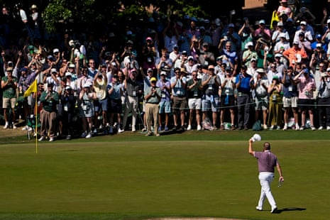 Shane Lowry, of Ireland, waves after a hole-in-one