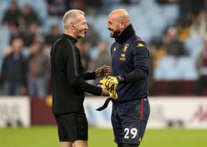 Aston Villa goalkeeper Pepe Reina with referee Martin Atkinson.