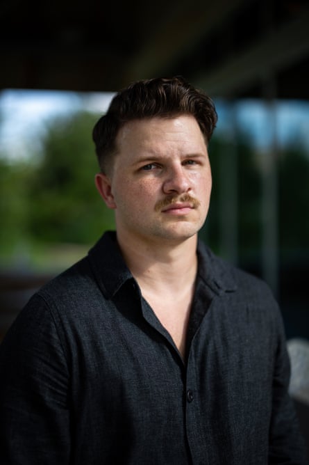 a man looking at a camera