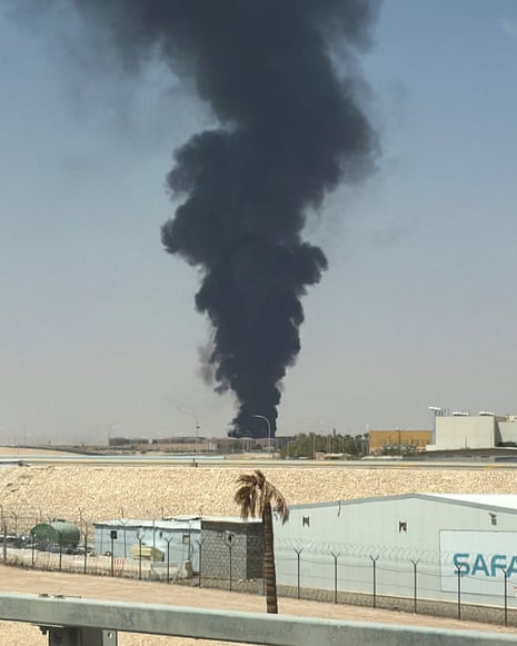 Smoke rises from the fuel storage depot at King Khalid International airport