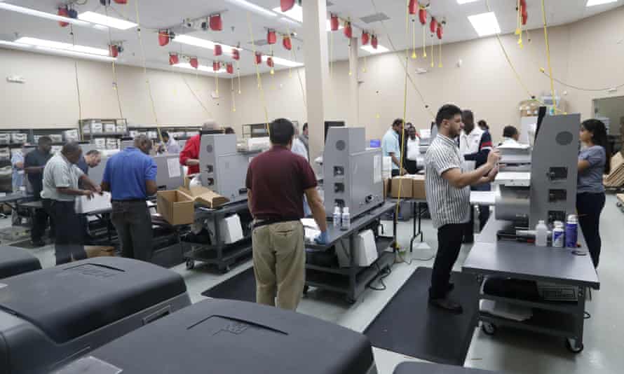 Employees at the Broward county supervisor of elections office count ballots during a recount on Wednesday.