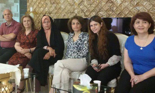 Faezeh Hashemi, centre-left, sitting next to Fariba Kamalabadi, centre-right