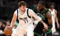 The Celtics’ Jaylen Brown defends the Mavericks’ Luka Doncic during the third quarter of a March game at Boston’s TD Garden