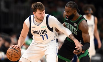 The Celtics’ Jaylen Brown defends the Mavericks’ Luka Doncic during the third quarter of a March game at Boston’s TD Garden