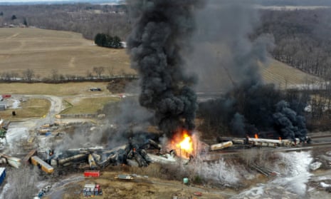 Portions of a Norfolk Southern freight train that derailed in East Palestine, Ohio on fire in February 2023. 