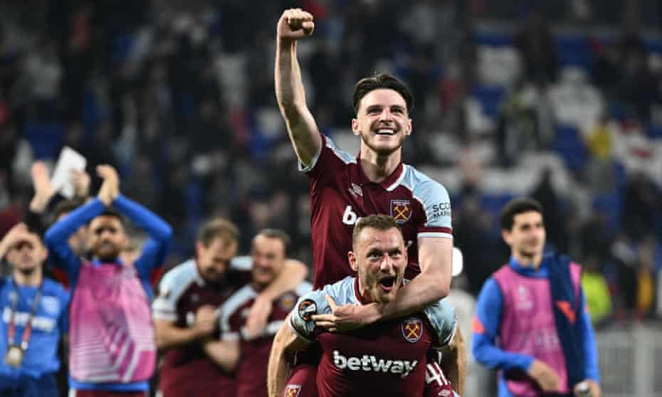 Declan Rice and Vladimir Coufal celebrate with the away fans after an unforgettable night in Lyon.