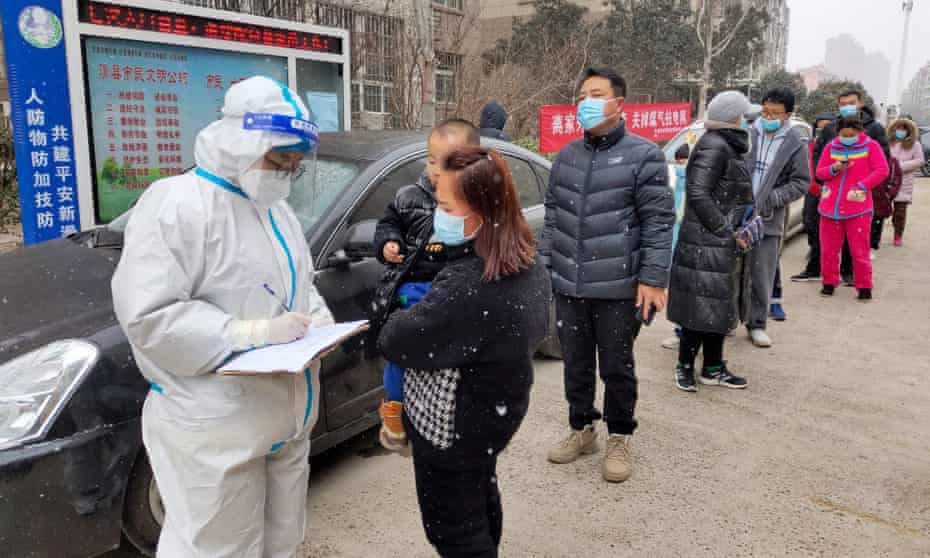 Residents queue for Covid-19 tests in Anyang, Henan province, on Friday.