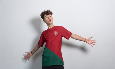 England’s united nations of football: 32 teams, one World Cup – and a lot of excited kids | World Cup 2022 25 Gabriel Almeida with his arms outstretched, wearing a red-and-green Portugal shirt