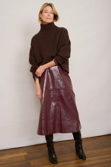 Model wearing vinyl skirt and sweater