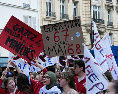 Students hold up placards during a demonstration in France
