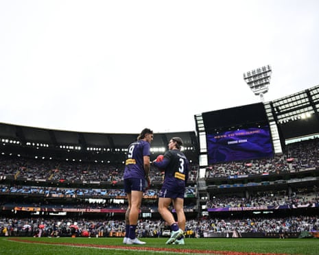 Luke Jackson and Caleb Serong warm up before the AFL grand final