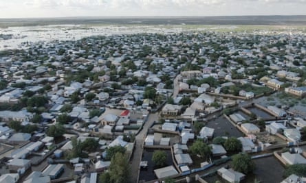 overhead shot of many houses surrounded by water