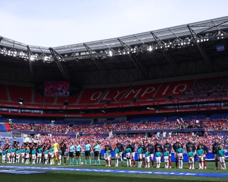 OL Lyonnes and Arsenal players line up before the semi-final second leg at Lyon.