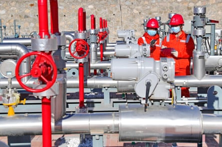 Technicians inspect the East-Route pipeline at a gas-distributing station in Qinhuangdao, China.