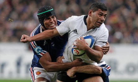 Charles Piutau is tackled by Thierry Dusautoir