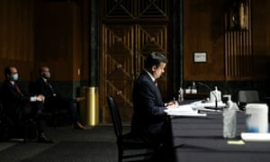 Senators wear masks and practice social distancing rules at the nomination hearing of John Ratcliffe.