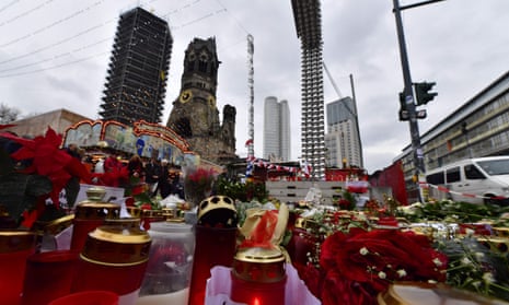 Candles, flowers and individual messages are placed at a makeshift memorial for the victims of the Christmas market attack.