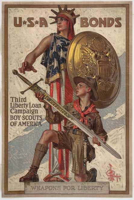 Image of a boy scout in uniform holding a sword inscribed “Be prepared.”