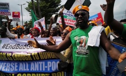 Protesters carrying banners and placards