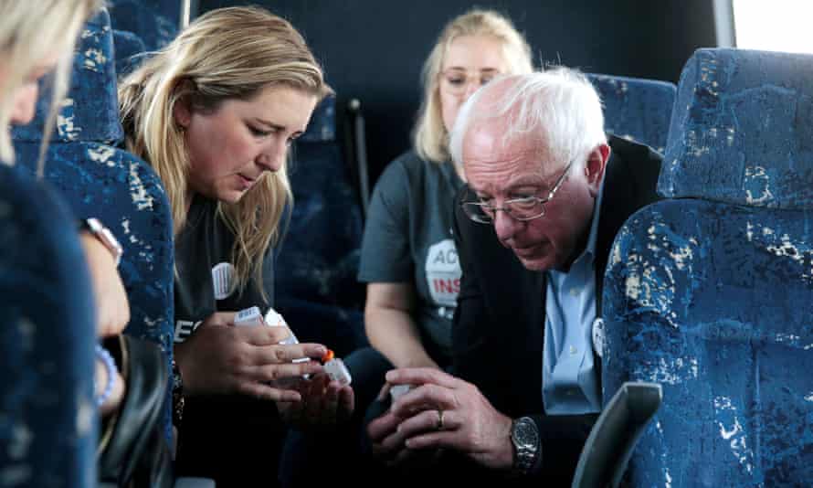 Sanders talks with type 1 diabetes advocate Quinn Nystrom as they ride the bus across the border.